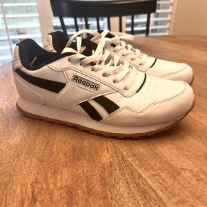 Reebok Classic Sneaker. Size 9. White with black accents. Gum rubber sole.